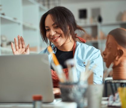 nice-female-potter-using-laptop-in-pottery-worksho-2023-11-27-04-57-37-utc.jpg